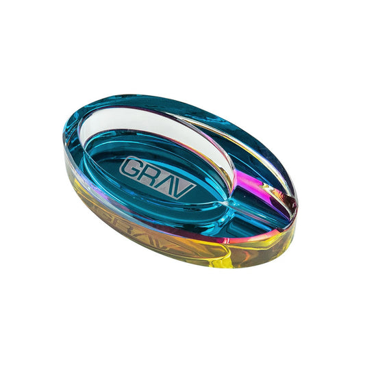 The GRAV Ellipse ashtray may have a simple purpose, but that doesn’t mean it can’t be a work of art. From the side, this designer ashtray appears clear. But from the top down, the mirror backing creates an iridescent effect of shimmering blues, pinks, purples, and yellows. The large groove can hold a cigarette, joint, or cigar. Sesh with KanAccessories